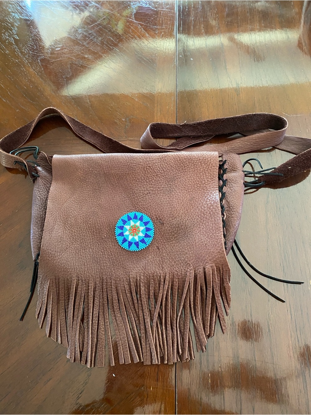 Brown Fringe Crossbody Bag with Beaded Medallion